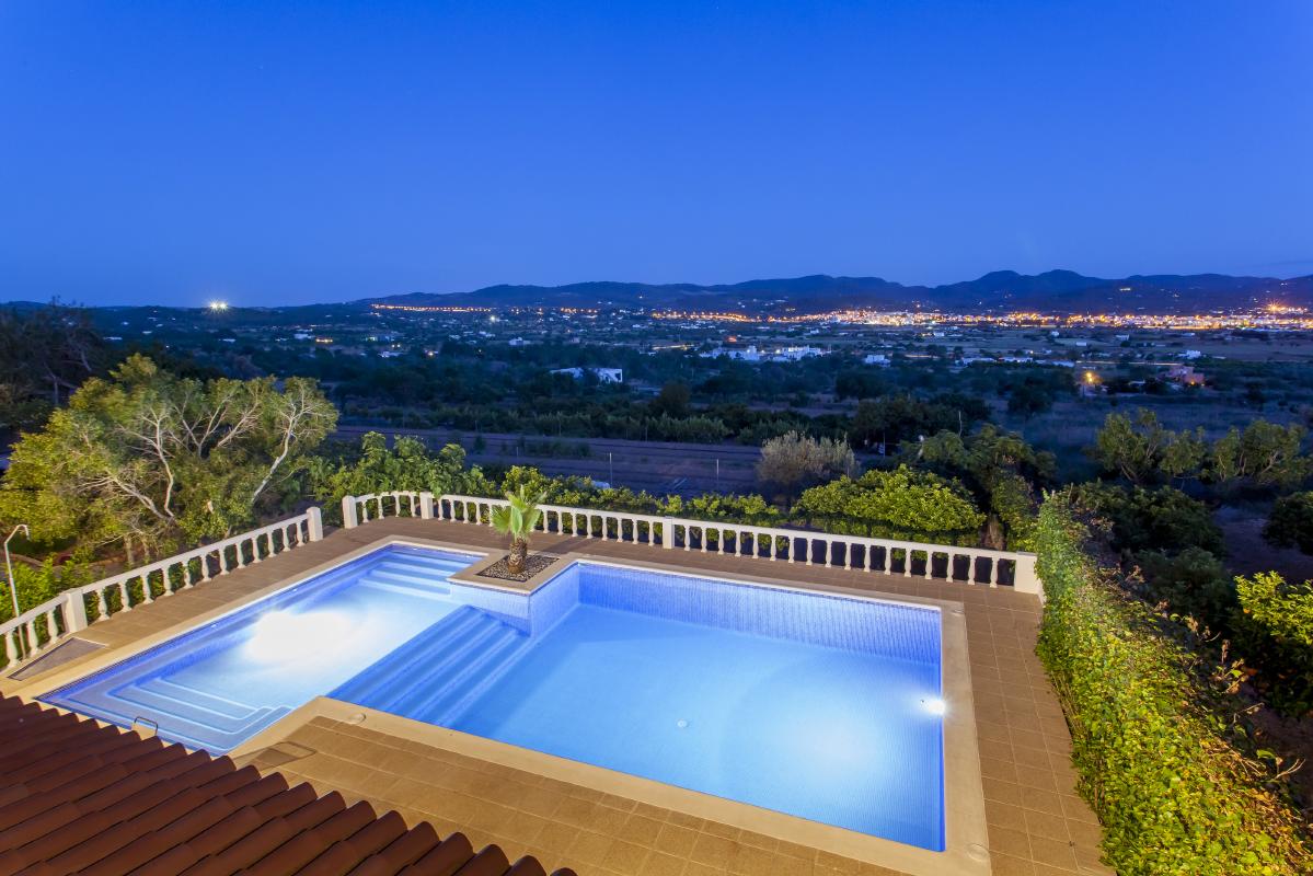 Lovely view at night lighted pool and country setting